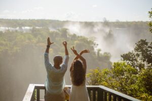 Visitors overlooking the mist of Victoria Falls